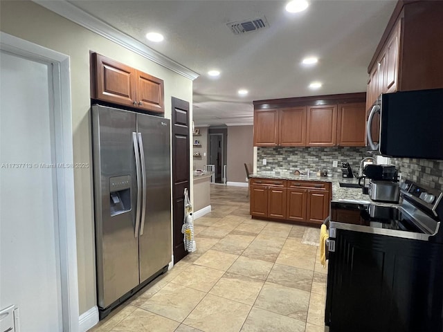 kitchen featuring ornamental molding, stainless steel appliances, and backsplash