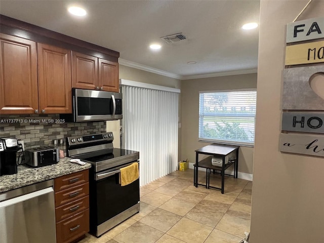 kitchen with light tile patterned floors, crown molding, stainless steel appliances, tasteful backsplash, and light stone countertops