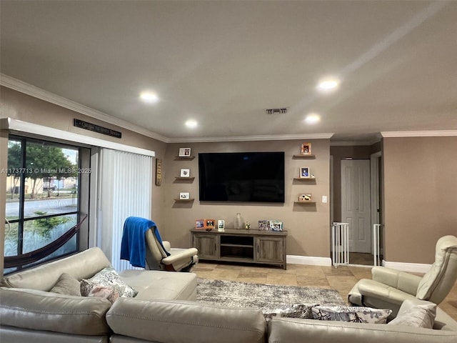 home theater room with ornamental molding