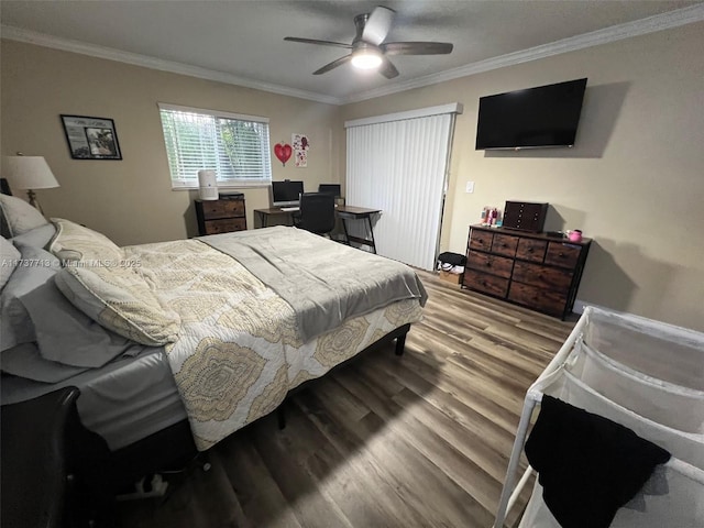 bedroom with ornamental molding, hardwood / wood-style floors, and ceiling fan