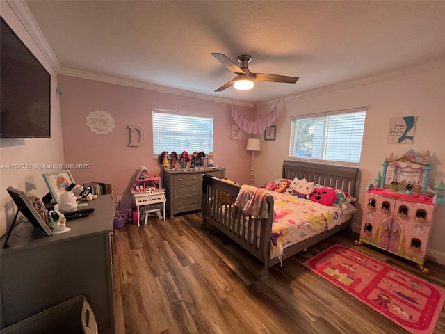 bedroom featuring crown molding, dark hardwood / wood-style floors, and ceiling fan