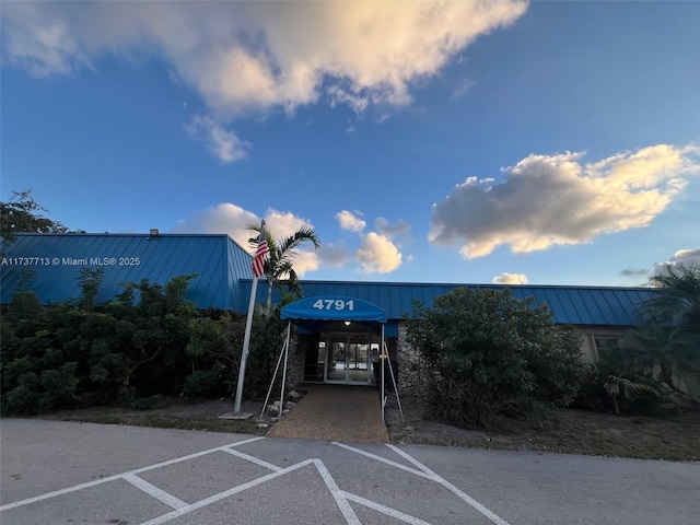 view of outdoor building at dusk