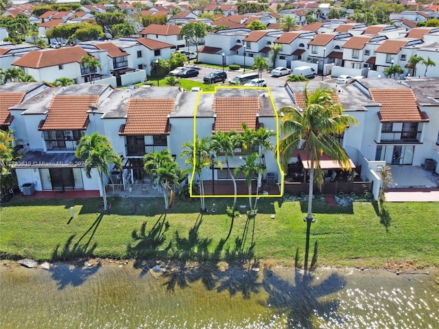 bird's eye view with a residential view and a water view