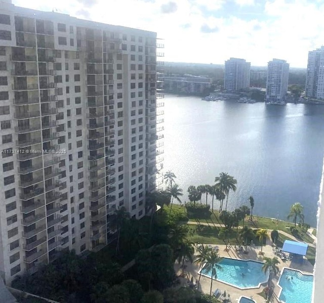 exterior space featuring a water view and a city view