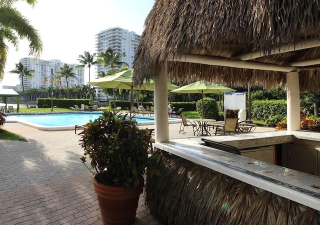 community pool featuring a patio area and a gazebo