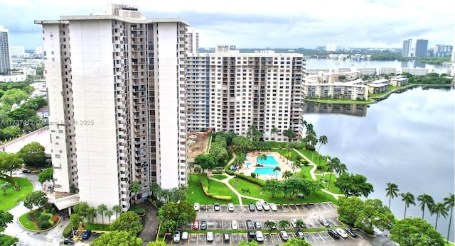 drone / aerial view featuring a water view and a city view