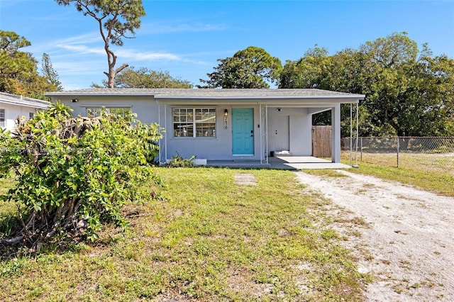 ranch-style house with a front lawn