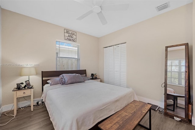 bedroom with ceiling fan and hardwood / wood-style floors