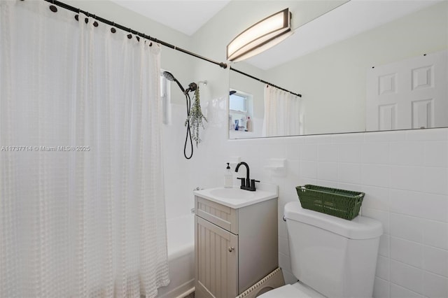 full bathroom featuring vanity, tile walls, shower / tub combo, and toilet