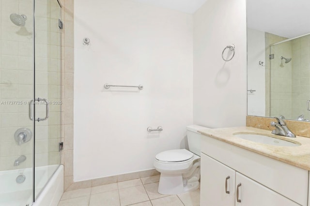 full bathroom featuring tile patterned flooring, vanity, bath / shower combo with glass door, and toilet