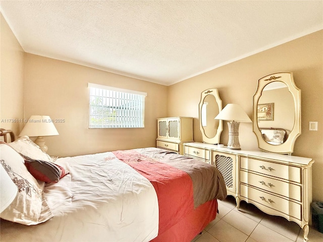 tiled bedroom featuring a textured ceiling