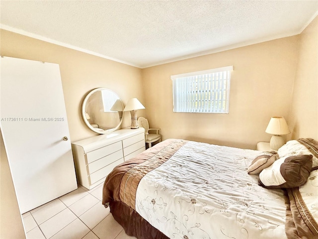 tiled bedroom featuring crown molding and a textured ceiling