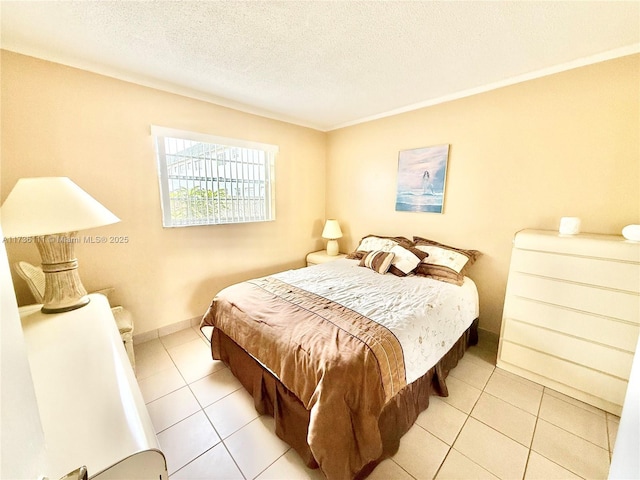 tiled bedroom featuring a textured ceiling