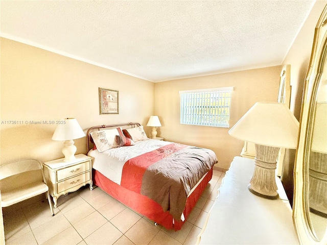 bedroom with tile patterned floors and a textured ceiling