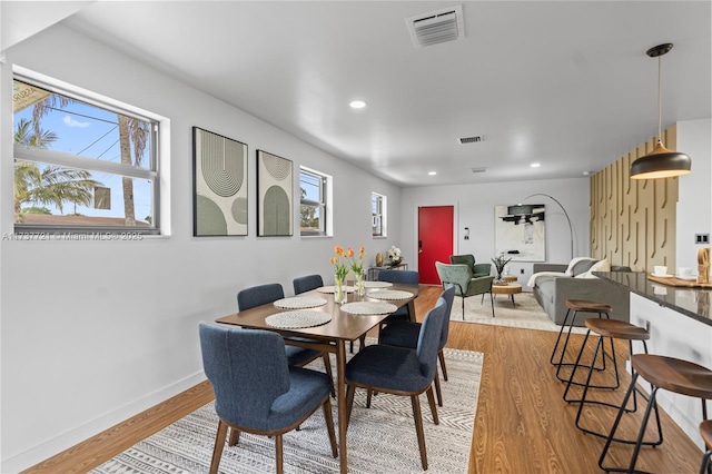 dining room with plenty of natural light and light wood-type flooring