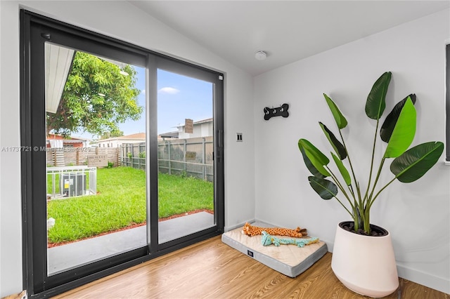 entryway with hardwood / wood-style flooring