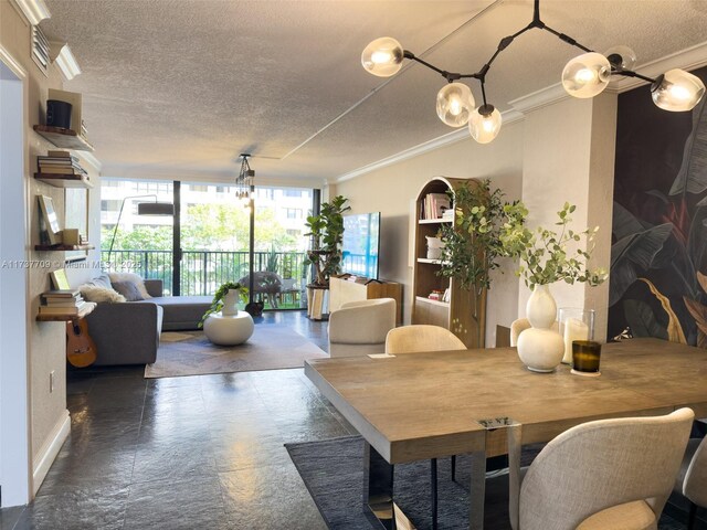 dining area with crown molding, an inviting chandelier, and a textured ceiling