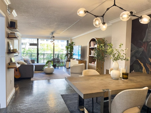 dining space featuring a textured ceiling, expansive windows, a chandelier, and crown molding