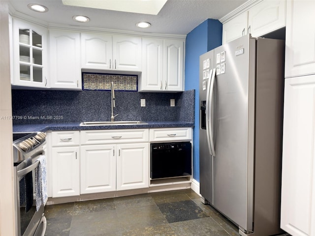 kitchen featuring appliances with stainless steel finishes, a sink, and white cabinetry