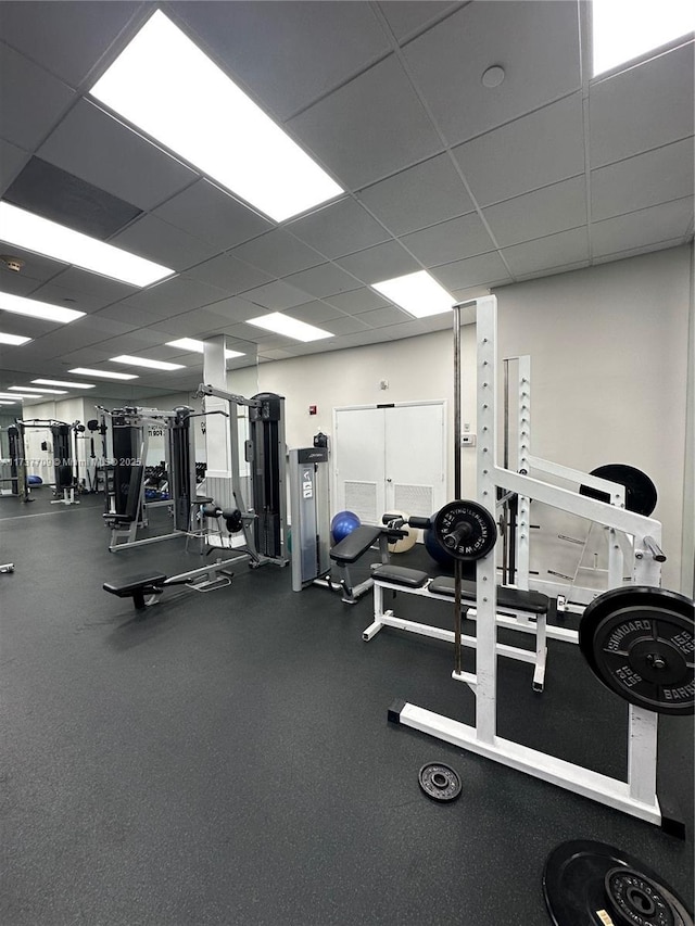 exercise room featuring a drop ceiling