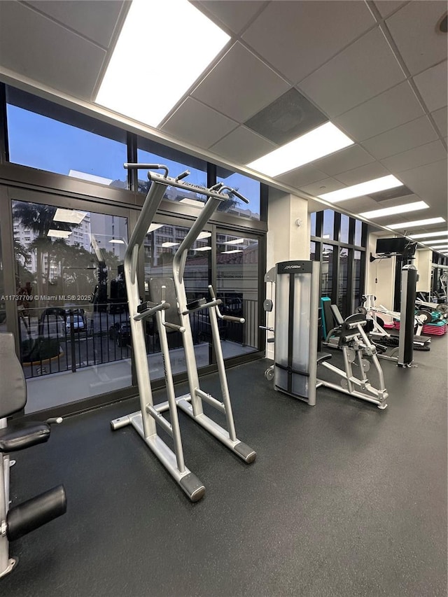 gym featuring a paneled ceiling