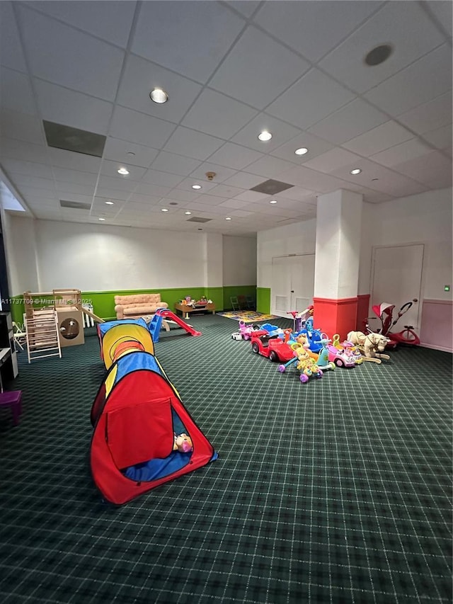 playroom featuring a paneled ceiling, carpet, and recessed lighting