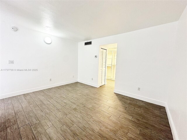 unfurnished room featuring light hardwood / wood-style floors