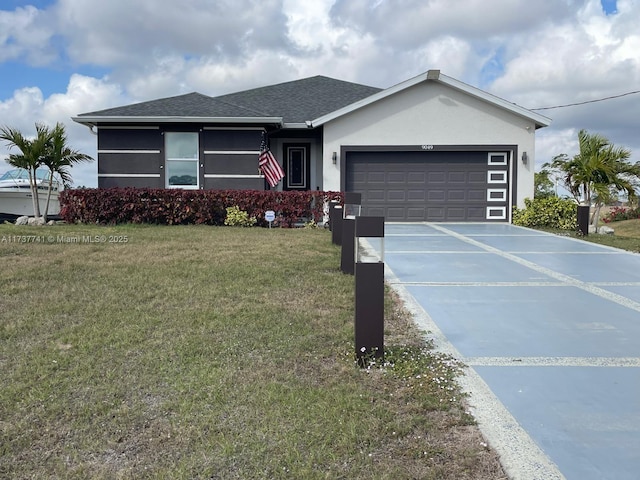 view of front of home featuring a garage and a front lawn