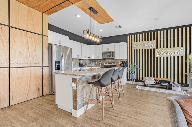 bathroom with vanity, hardwood / wood-style floors, and toilet