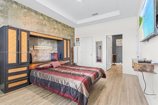9049 Green Cir, La Belle, FL 33935 - bedroom with a tray ceiling, baseboards, visible vents, and wood finished floors