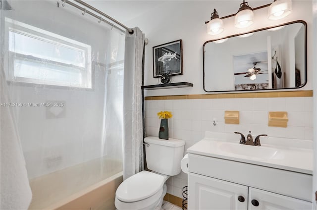 full bathroom with vanity, tile walls, shower / bathtub combination with curtain, and toilet