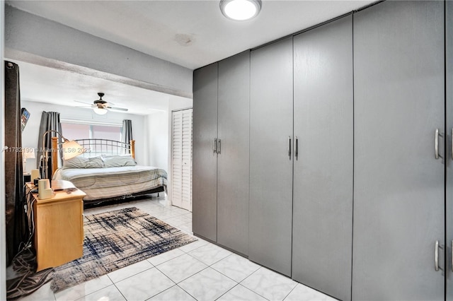 bedroom featuring light tile patterned floors and ceiling fan