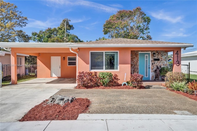 view of front of house with a carport