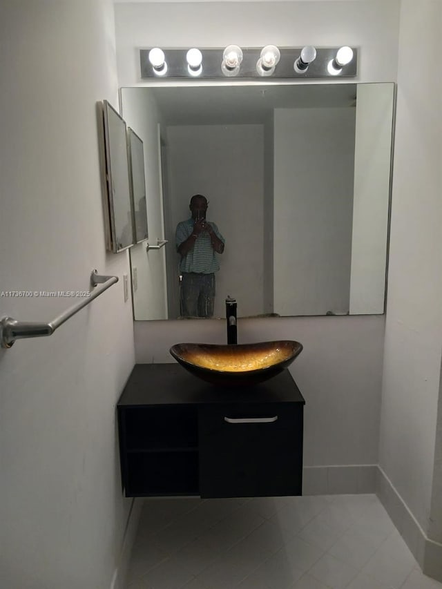 bathroom featuring tile patterned flooring and vanity