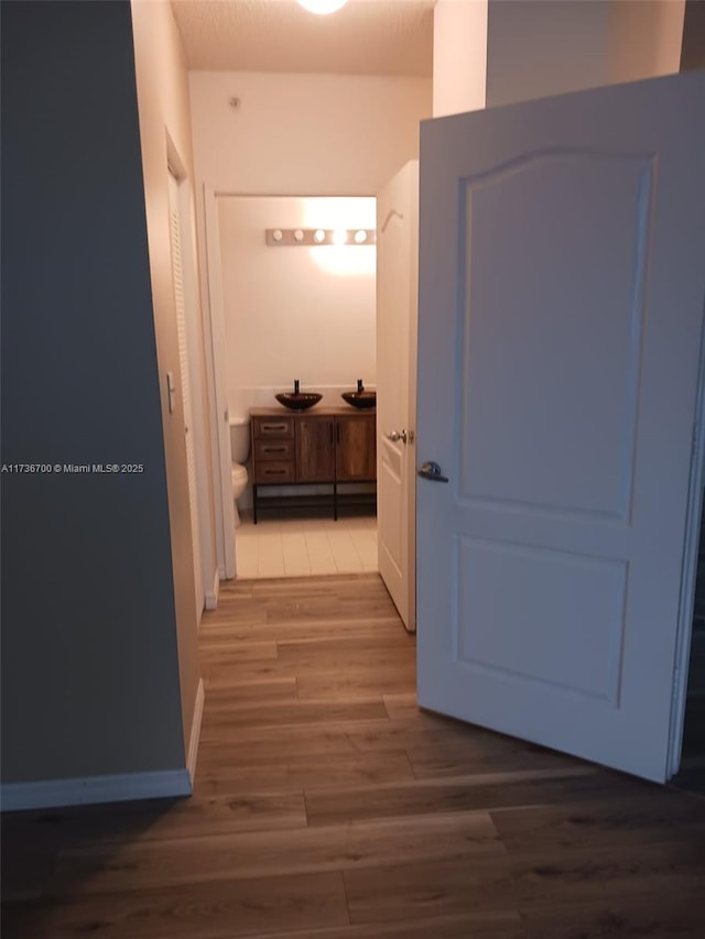 hallway with dark wood-type flooring