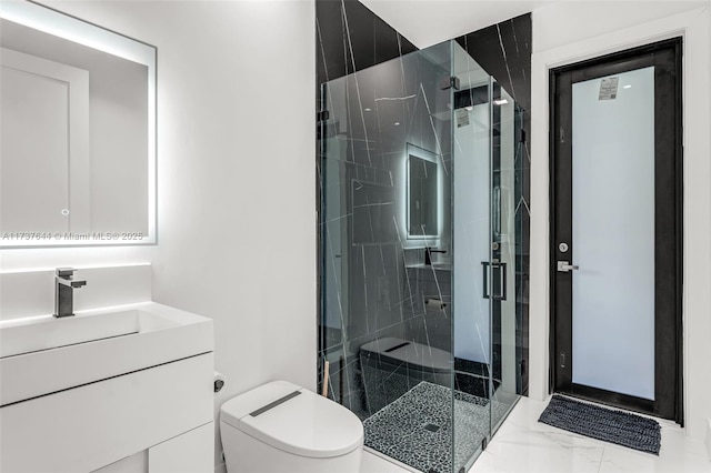 bathroom with vanity, toilet, and an enclosed shower