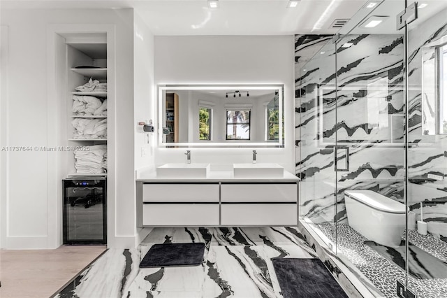 bathroom with vanity, beverage cooler, toilet, and walk in shower