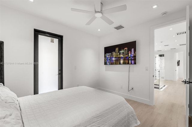 bedroom with ceiling fan and light wood-type flooring