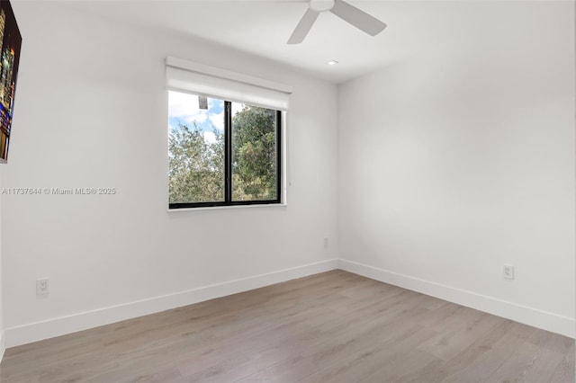 unfurnished room with ceiling fan and light hardwood / wood-style flooring