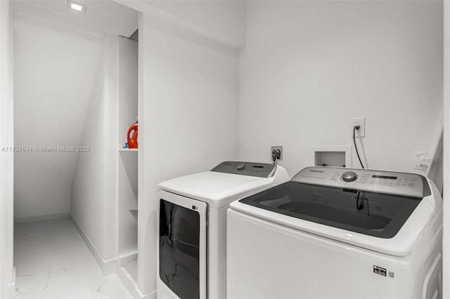 washroom with independent washer and dryer