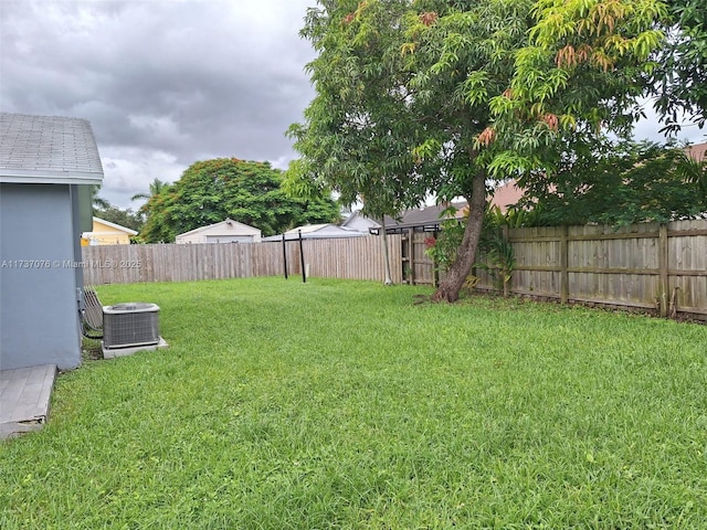 view of yard with central AC