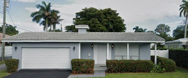 single story home with a garage