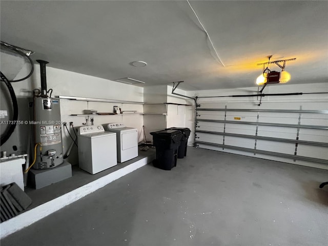 garage featuring a garage door opener, washer and clothes dryer, and gas water heater