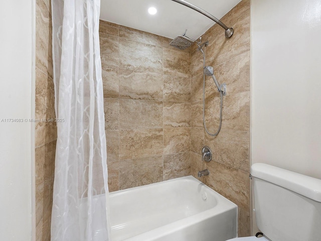 full bathroom featuring shower / tub combo and toilet