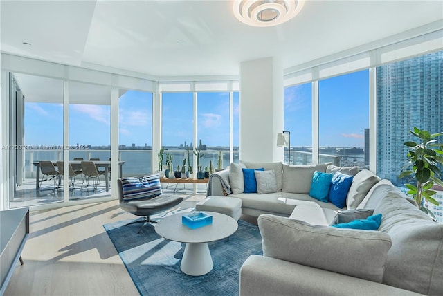 sunroom / solarium featuring a water view