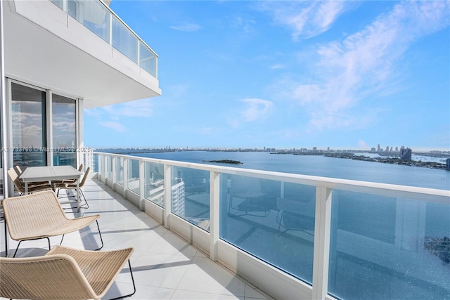 balcony featuring a water view