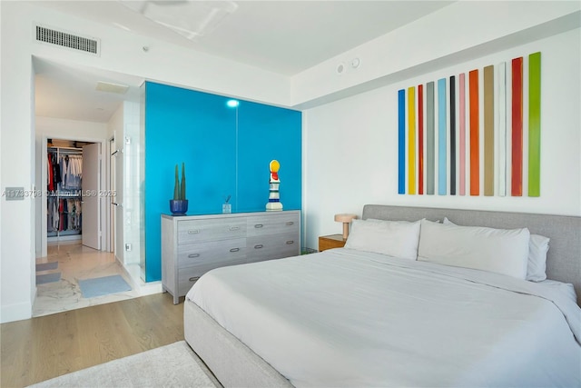 bedroom featuring light hardwood / wood-style flooring