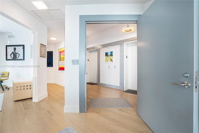 hall featuring light hardwood / wood-style floors