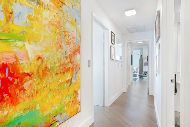 corridor featuring light hardwood / wood-style floors