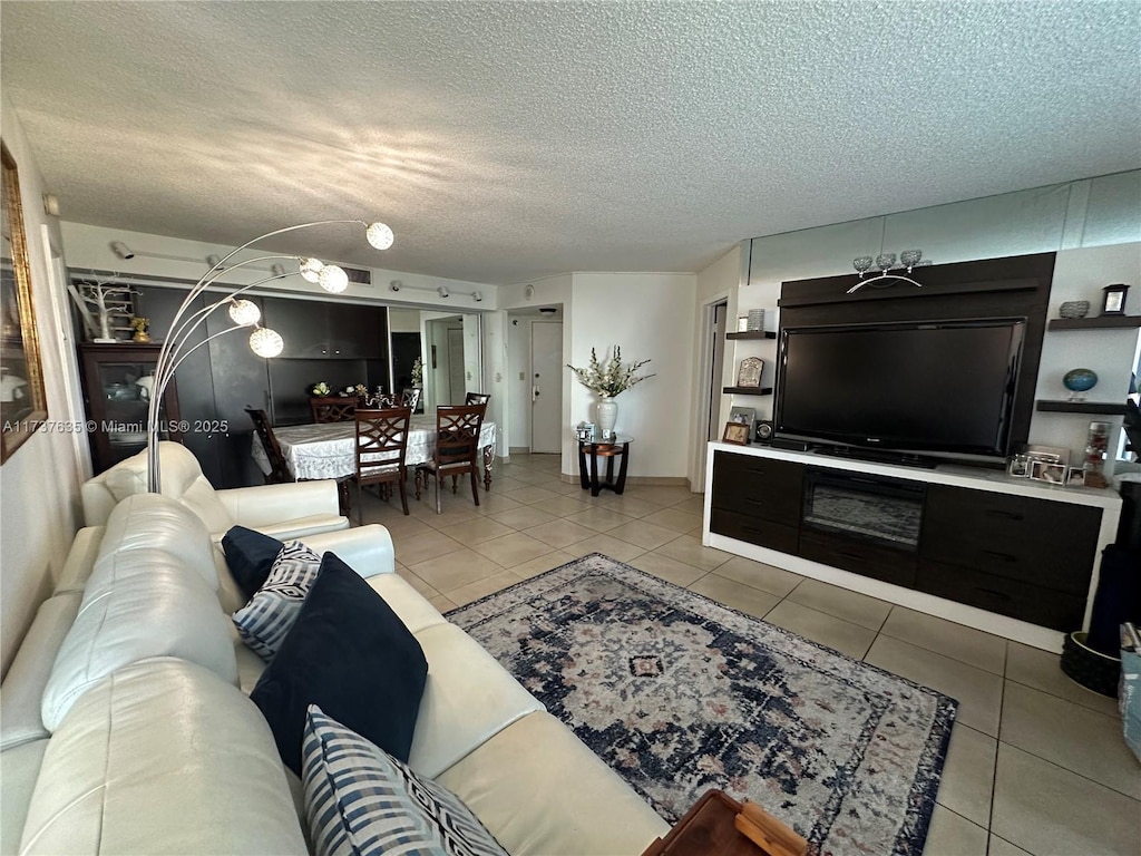 tiled living room with a textured ceiling